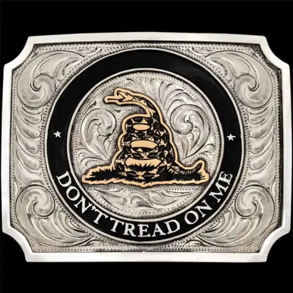 "Stand strong, live free—don’t tread on me! Our Don't Tread on Me Belt Buckle is expertly crafted on a German Silver base featuring a striking hand-painted black enamel circle outline. The centerpiece displays our Jeweler’s Bronze timber rattlesnake,
